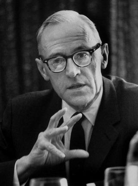 Black-and-white portrait of Oskar Morgenstern gesturing.